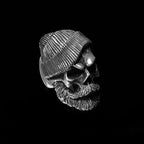 Bearded tough guy wearing hat skull rings for men