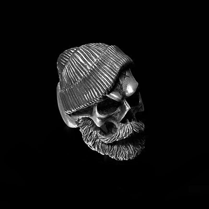 Bearded tough guy wearing hat skull rings for men