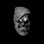 Bearded tough guy wearing hat skull rings for men