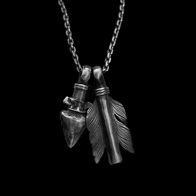 Arrowhead feather bullet pendant set in sterling silver