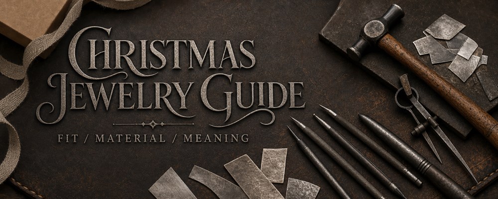 Christmas jewelry gift guide with silversmith tools, raw silver and wrapping materials on a dark workshop bench