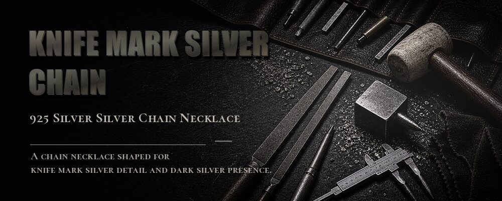 heavy hammered link chain necklace in a silver jewelry workshop
