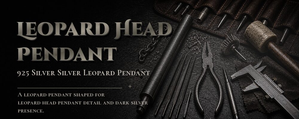 twin leopard head ring clasp chain in a silver jewelry workshop