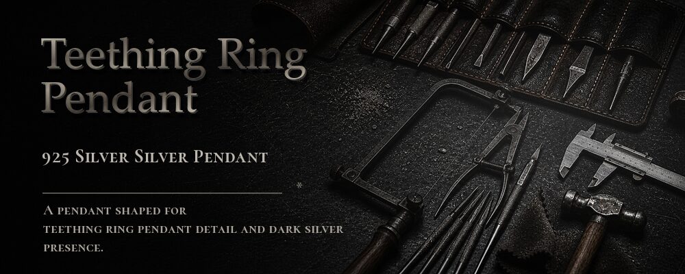 925 silver grinning teeth ring in a dark workshop