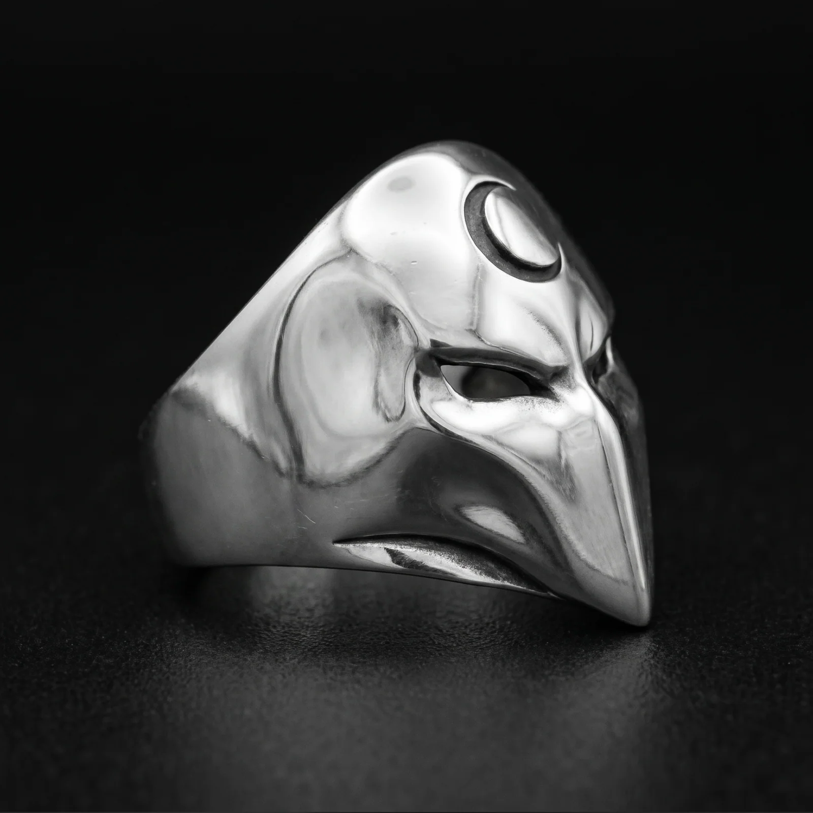 Sterling silver crescent moon mask ring right three-quarter view showing the broad shoulder and pointed profile