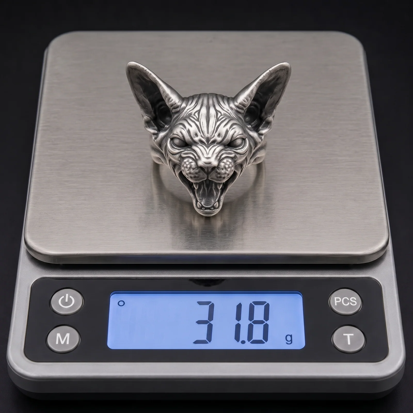 One Sphynx cat ring sample on a digital scale as a weight reference
