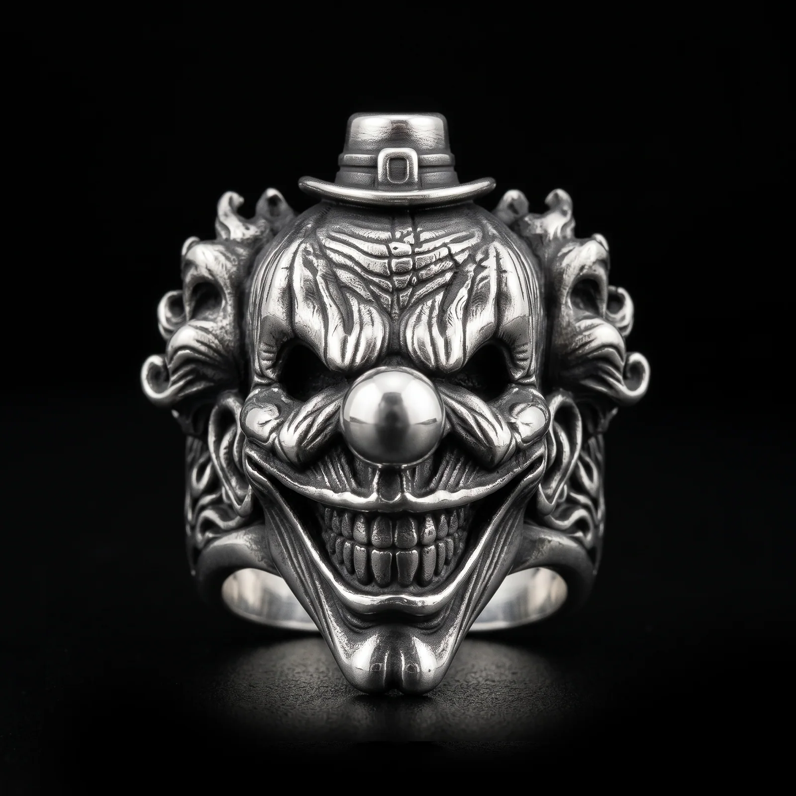Top hat clown ring front view with buckled hat, round nose and flame-like side relief