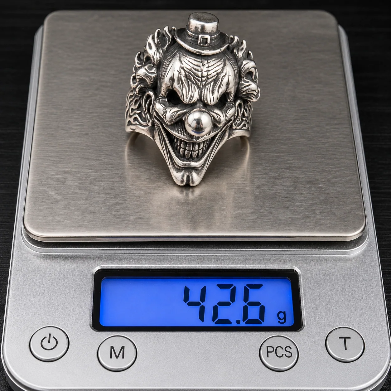 One top hat clown ring sample on a digital scale reading 42.6 g