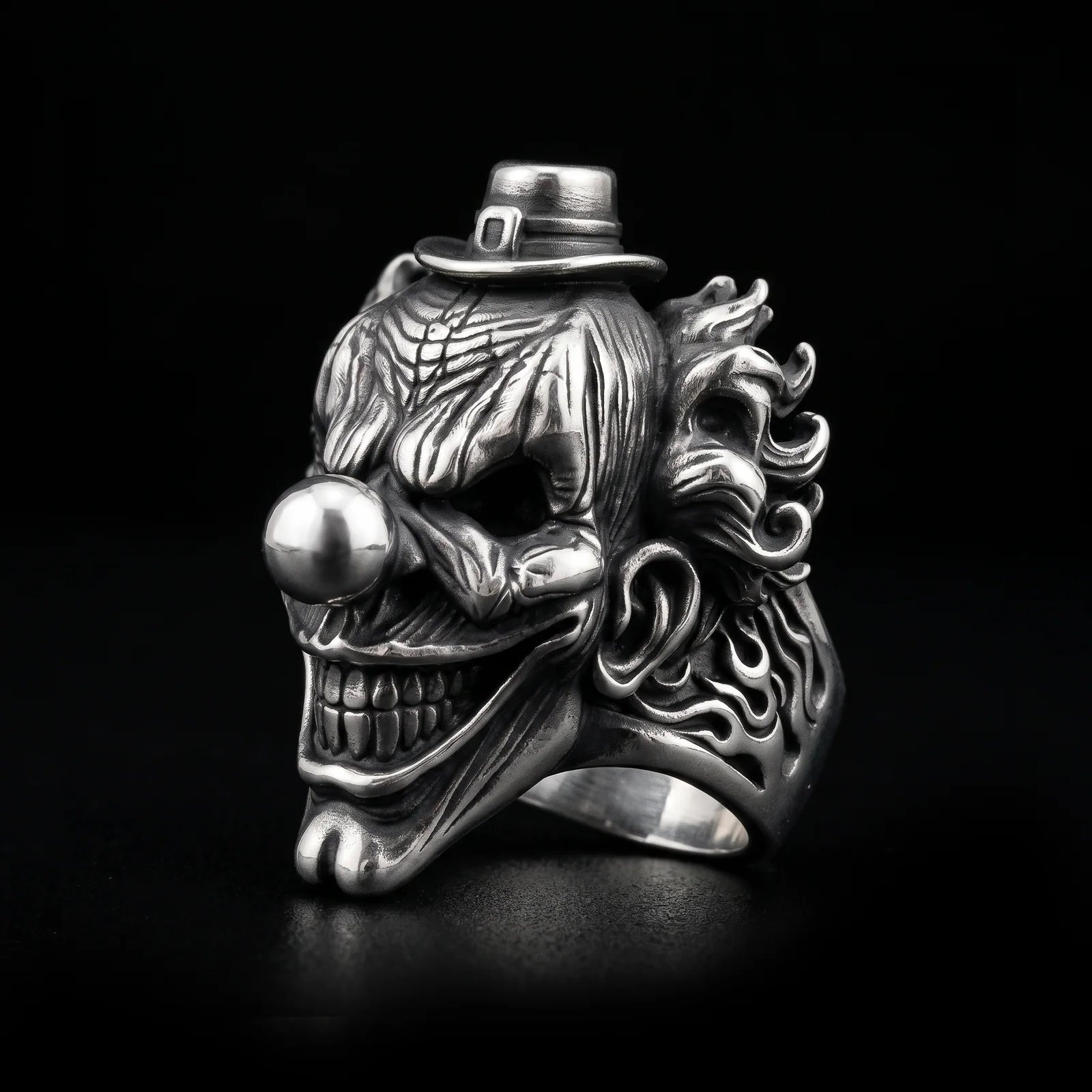 Top hat clown ring three-quarter view showing sculpted flame relief along the band