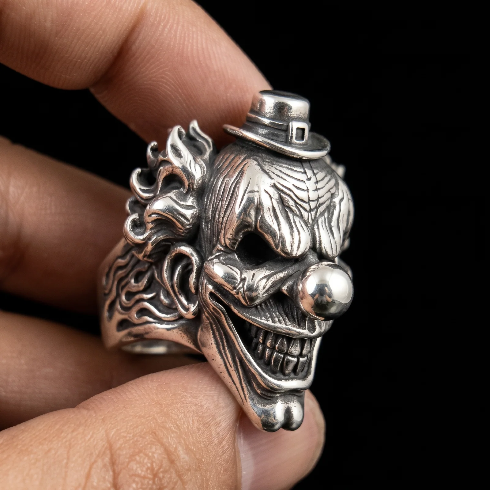 Top hat clown statement ring worn on a man's finger for scale