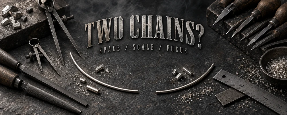 Two-necklace spacing represented by separated raw wire arcs, calipers, files, gravers and silver filings on a dark workshop bench